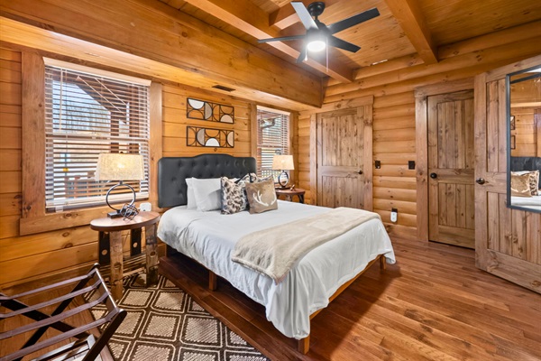 Main-level wheelchair-accessible primary suite near the front entrance — no stairs required, with private accessible bath.