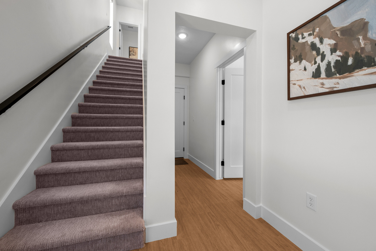 The staircase connects the home’s multiple levels while keeping the layout open and easy to navigate.