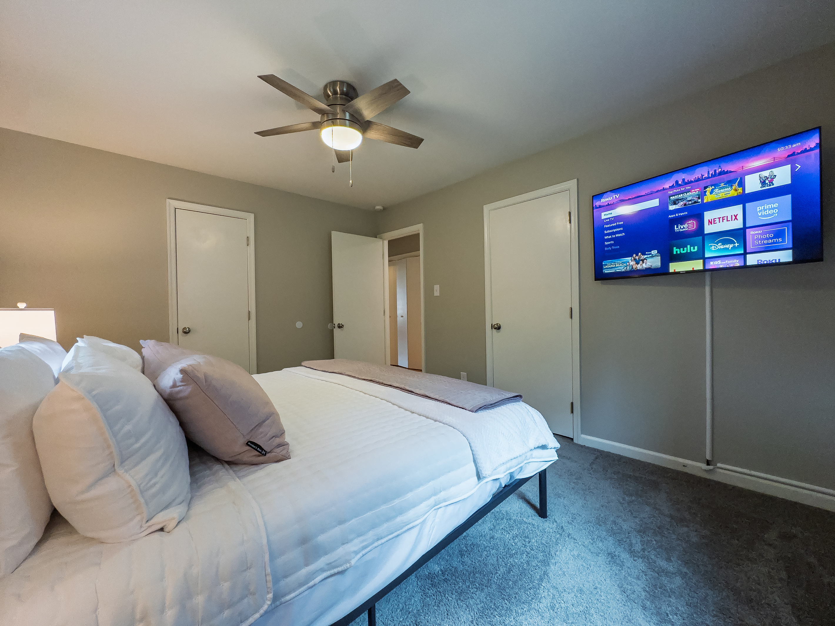 King bed, 55" Smart TV, ceiling fan, two led light nightstands with multiple charging ports, two multi light function lamps, blackout curtains, dual closets.