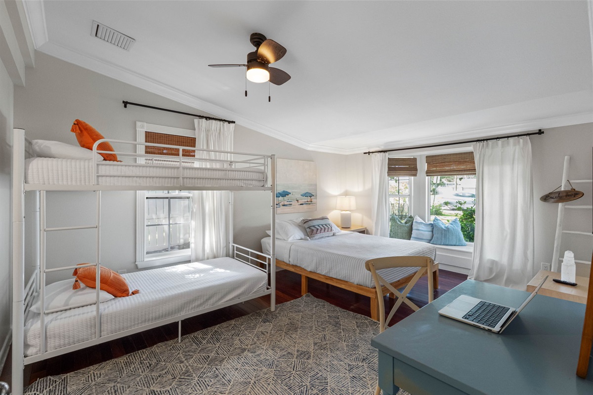 Comfortable queen bed complemented by a cozy bunk bed, providing flexible sleeping arrangements.