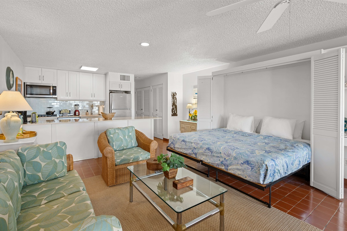 The murphy bed in the living room folds down into a king bed that is made up of two twins.