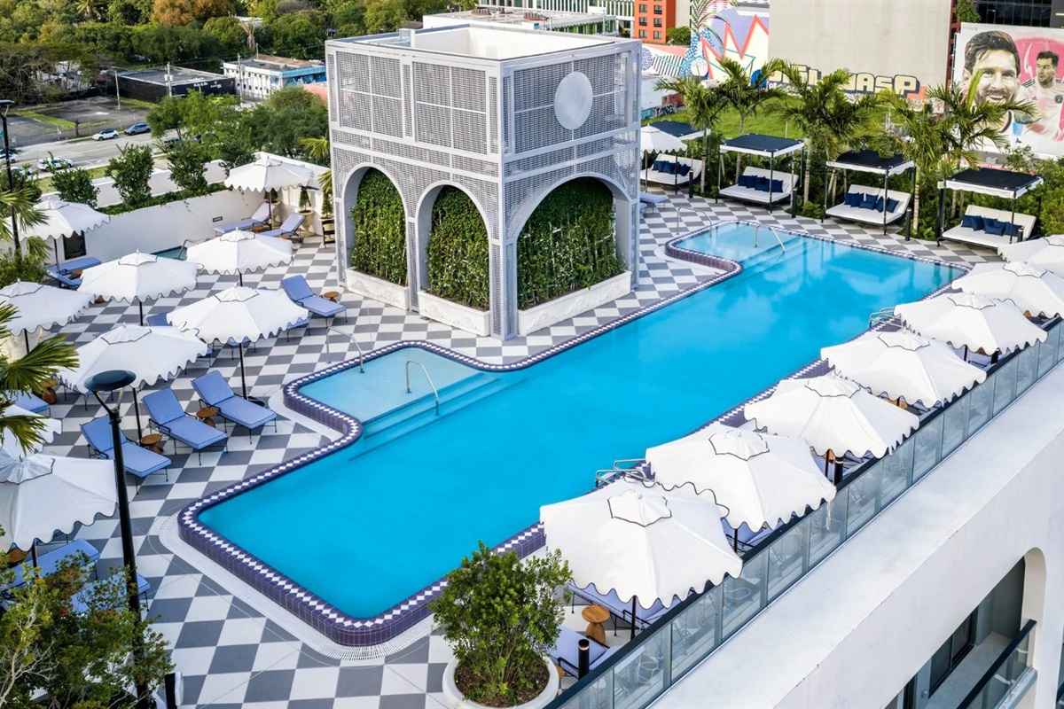 Rooftop saltwater pool &mdash; checkered deck, cabanas and Miami skyline backdrop
