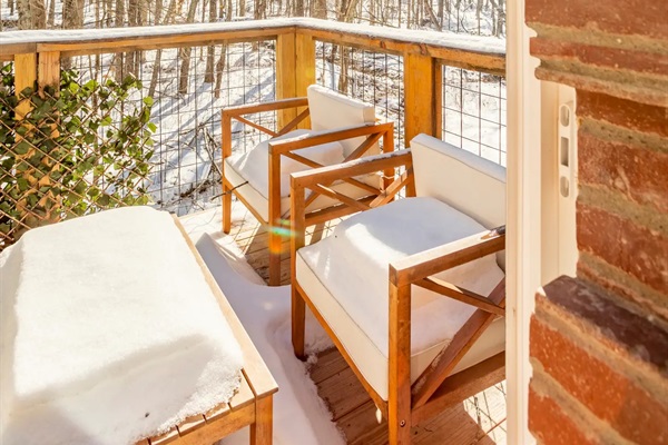 Front balcony off of primary bedroom provides private space for guests - especially when furniture isn't covered by snow!