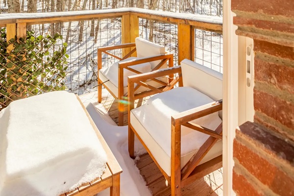 Front balcony off of primary bedroom provides private space for guests - especially when furniture isn't covered by snow!