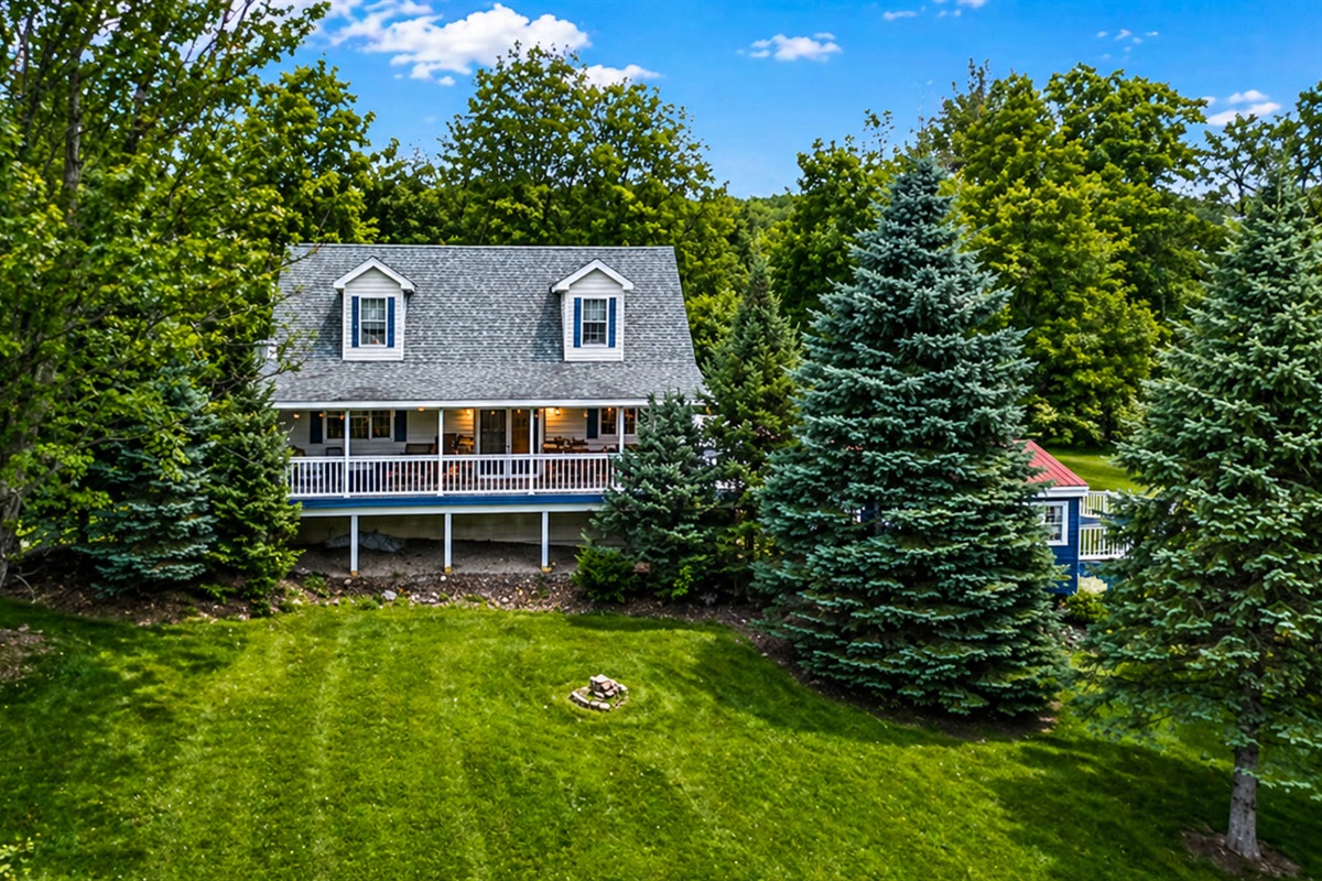 A stunning aerial shot capturing the entire property and its surroundings from above.