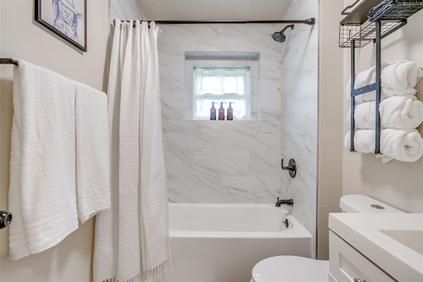 Fluffy towels, shampoo, conditioner, and soap—everything you need for a hotel-quality stay