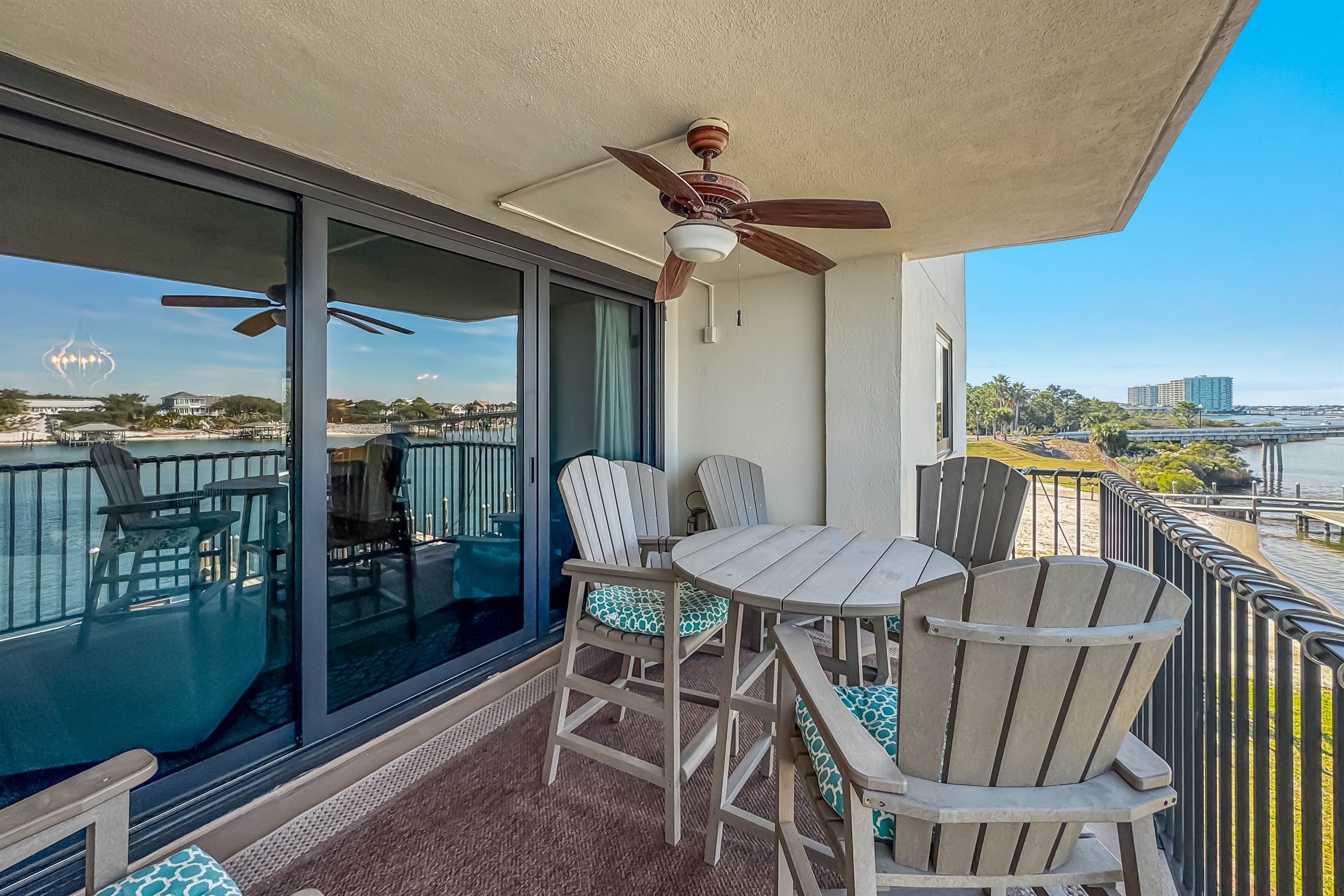 Enjoy your morning coffee or evening cocktail on this private balcony with stunning waterfront views and the gentle breeze from the ceiling fan. The perfect coastal retreat awaits.