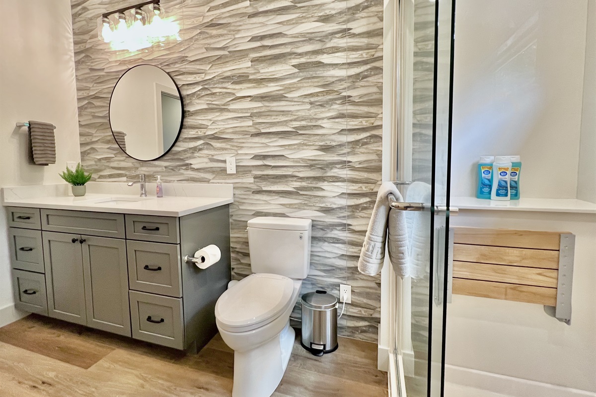 Main level bathroom with walk-in shower, seat, and upgraded heated toilet seat!