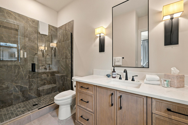 Ensuite bathroom #2 with plenty of storage and natural light