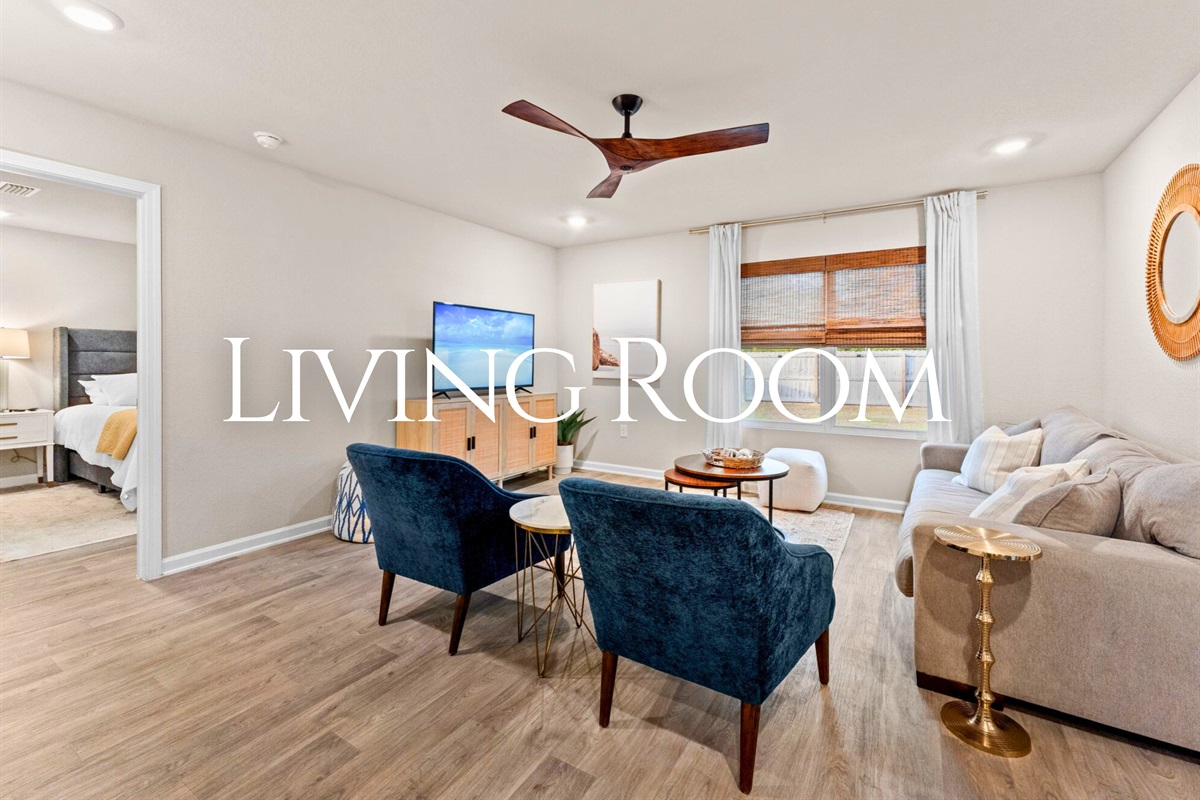 This cozy living room offers plenty of seating, making it easy to relax together after a day at the beach or exploring town.