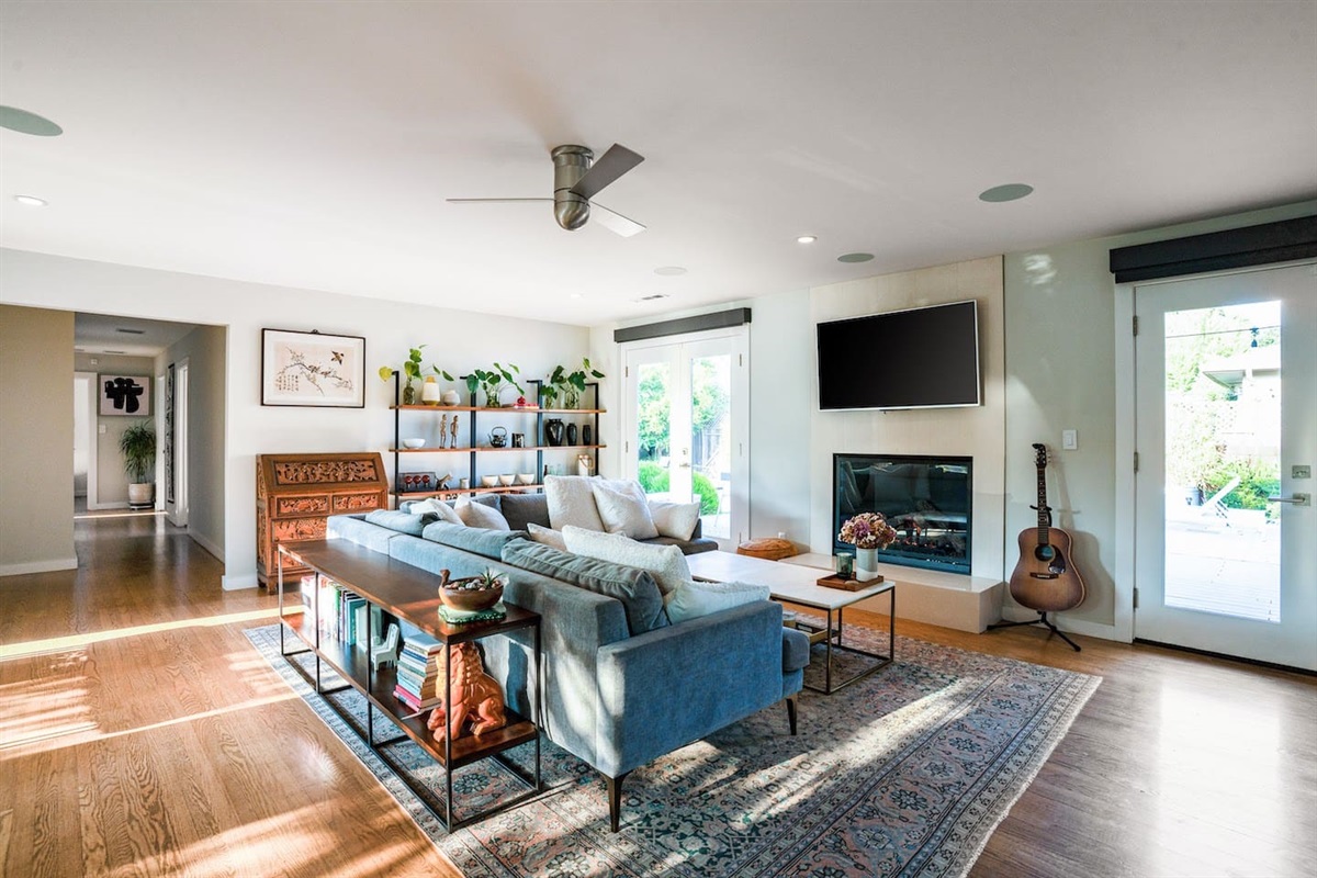Living area with smart tv and fireplace.