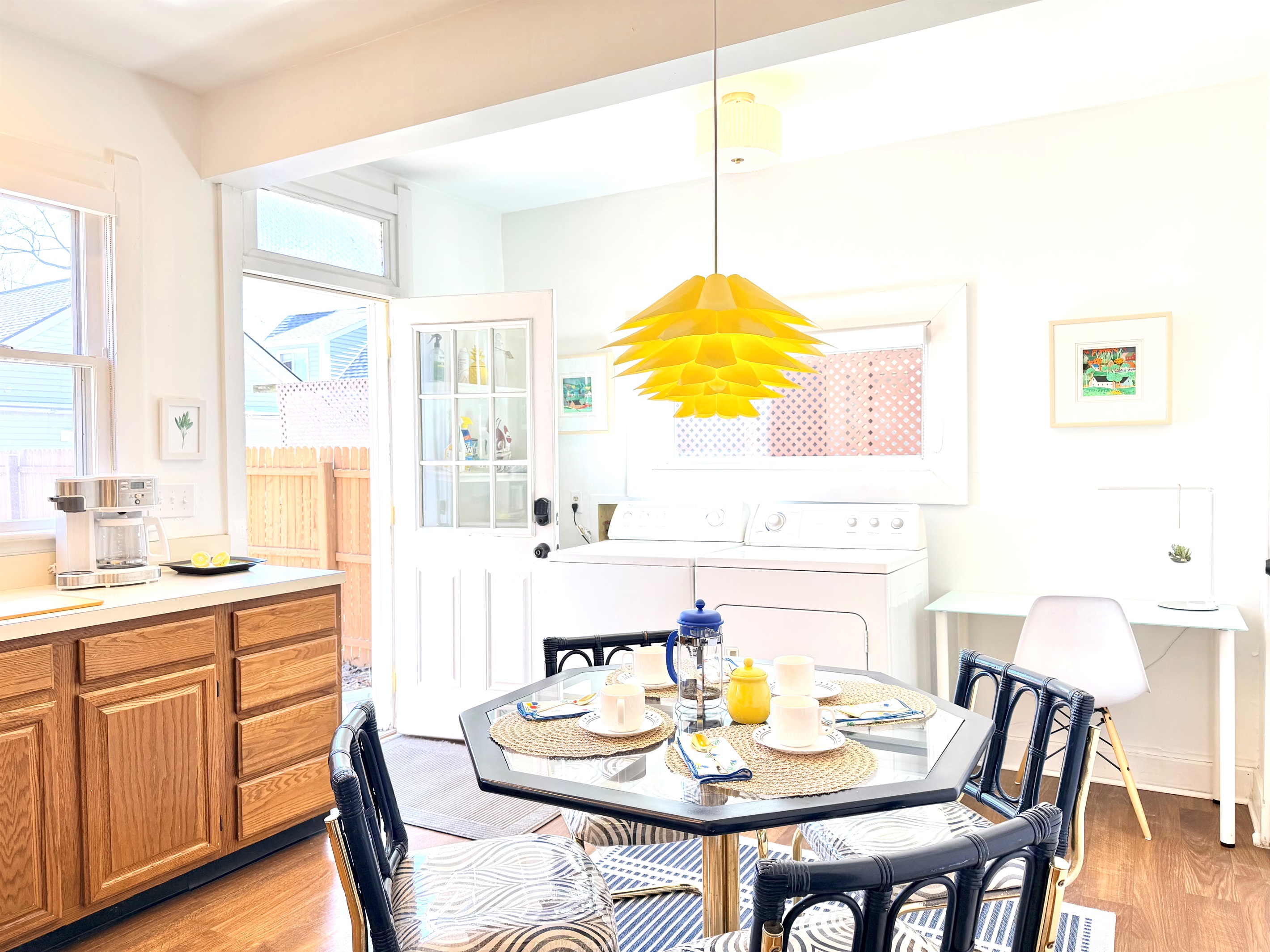 A fully appointed, light-filled kitchen with generous counter space and full-size appliances. A nostalgic eat-in setting perfect for coffee refills, conversation, and unhurried meals.