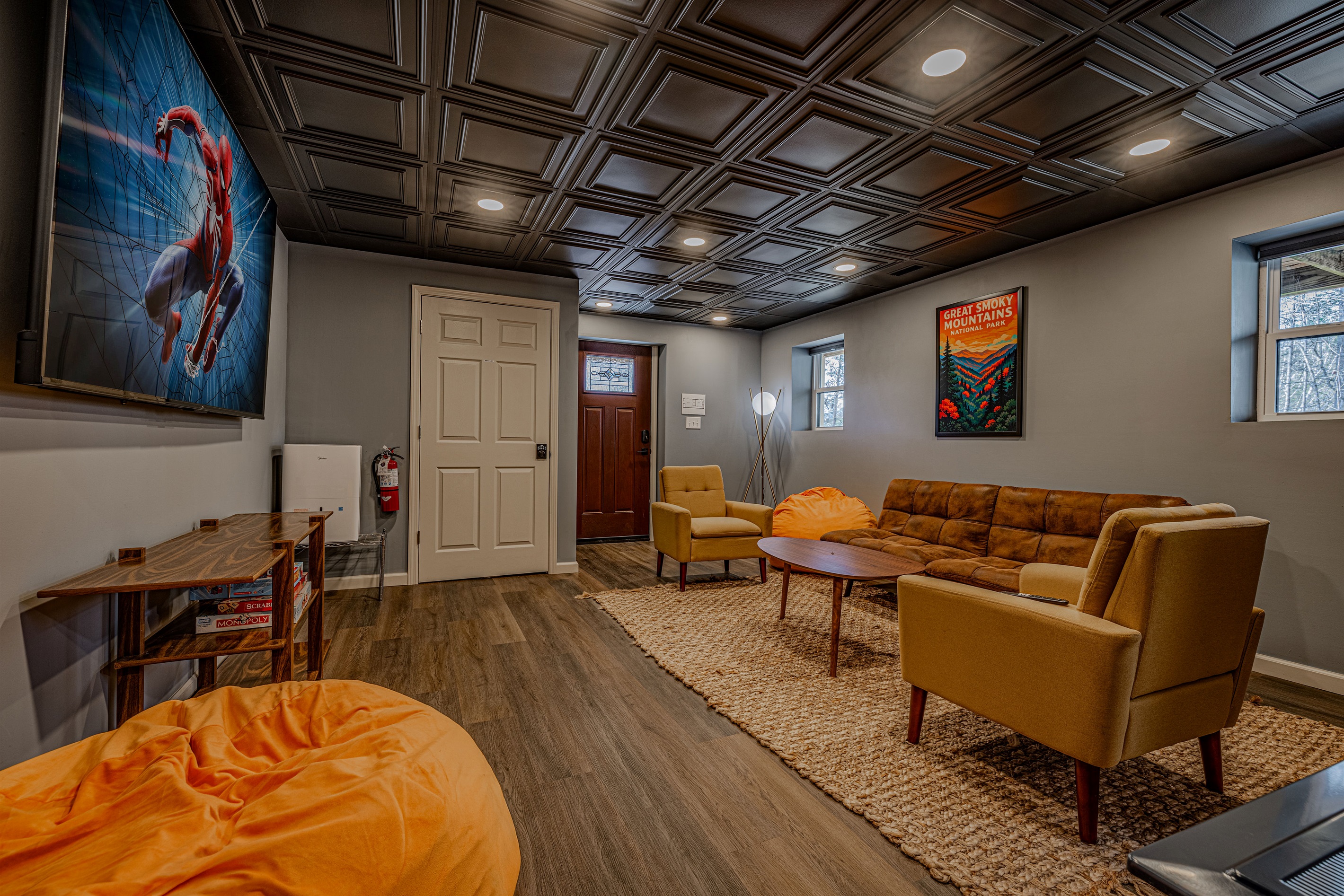 We love the details! The vintage-inspired poster and the dark wood flooring create a sophisticated, yet fun, mountain retreat vibe.