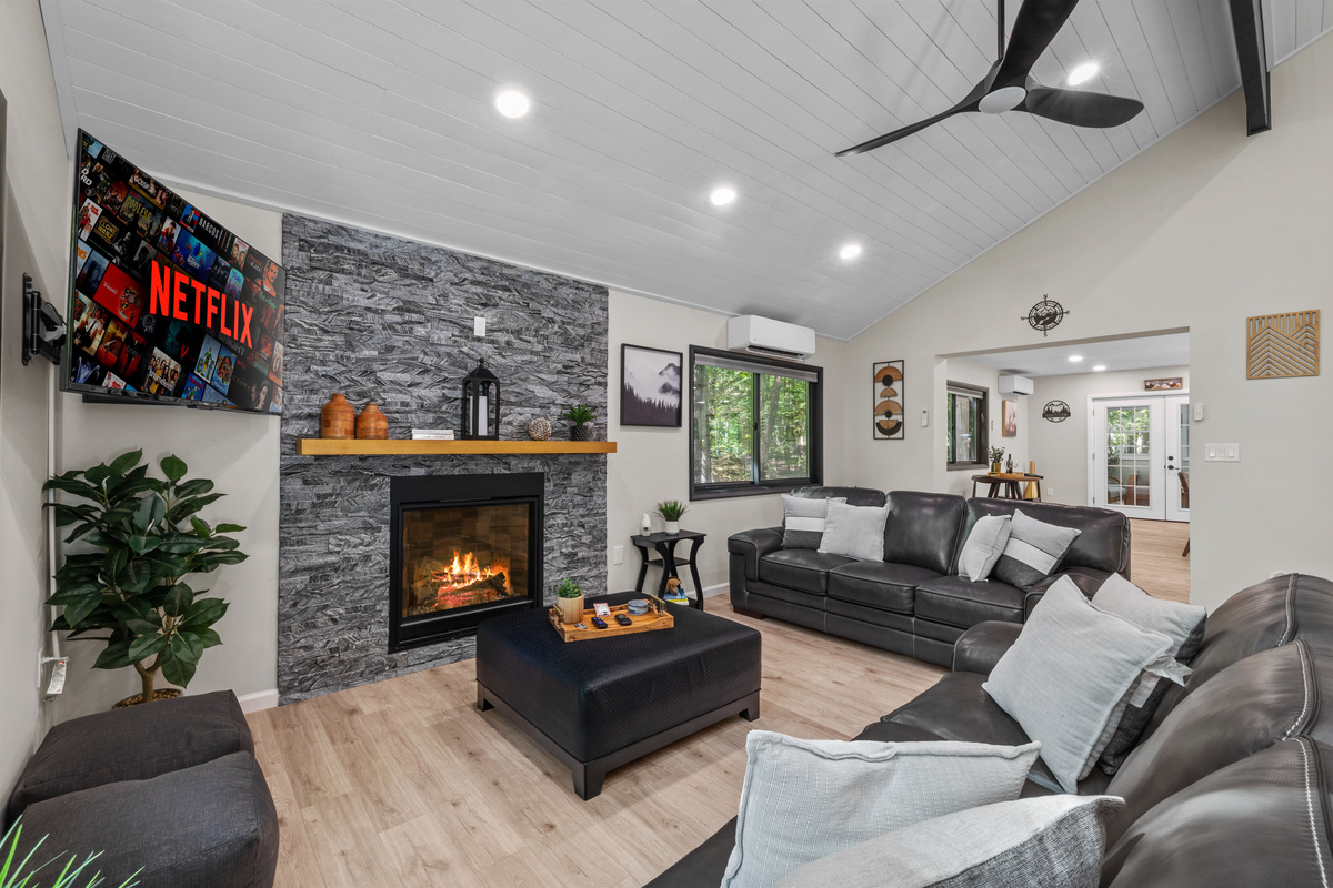 Cozy up with plush pillows, ignite the gas fireplace with a remote click 