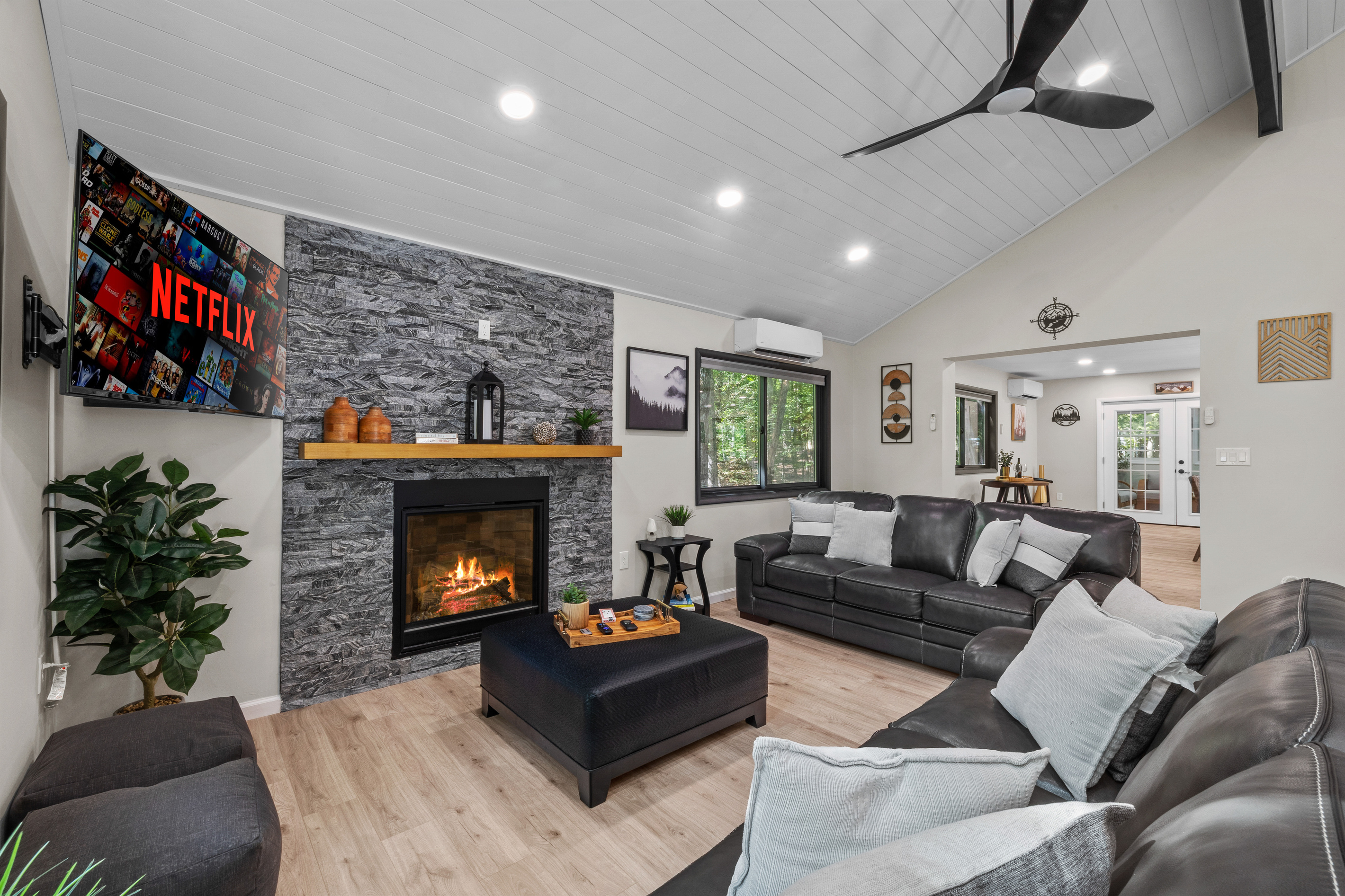 Cozy up with plush pillows, ignite the gas fireplace with a remote click 