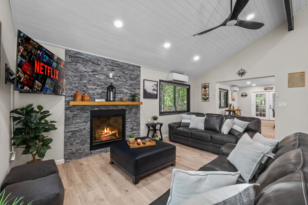 Cozy up with plush pillows, ignite the gas fireplace with a remote click 