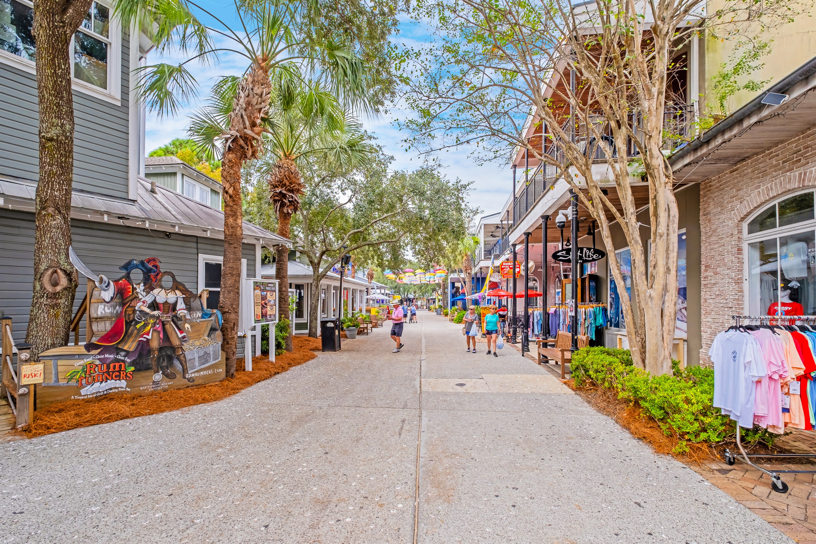 Bright and colorful storefronts on a bustling pedestrian street. Ideal for window shopping and discovering unique local finds.