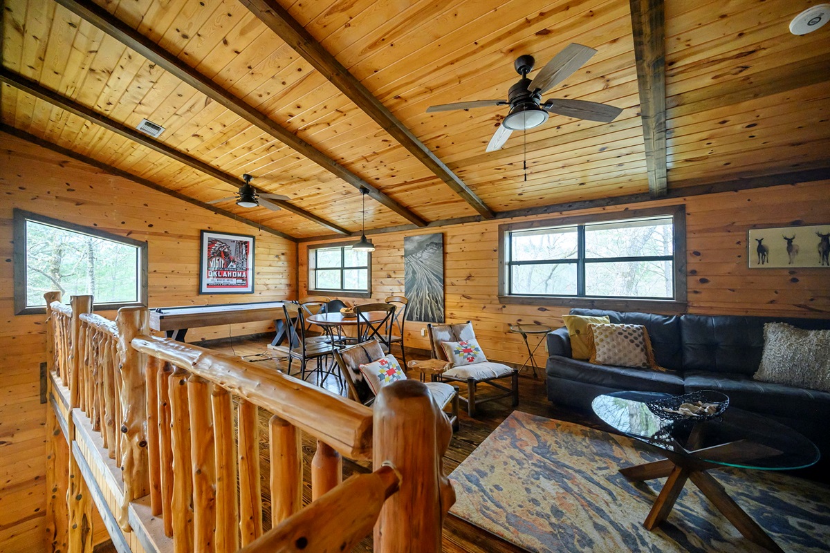 Loft Area with Smart TV, Table and 4 Chairs, and Air Hockey