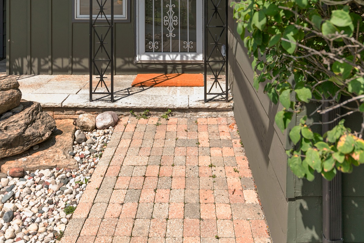 The front door features a secure Schlage smart lock, where you’ll enter your designated code to access the property with ease.