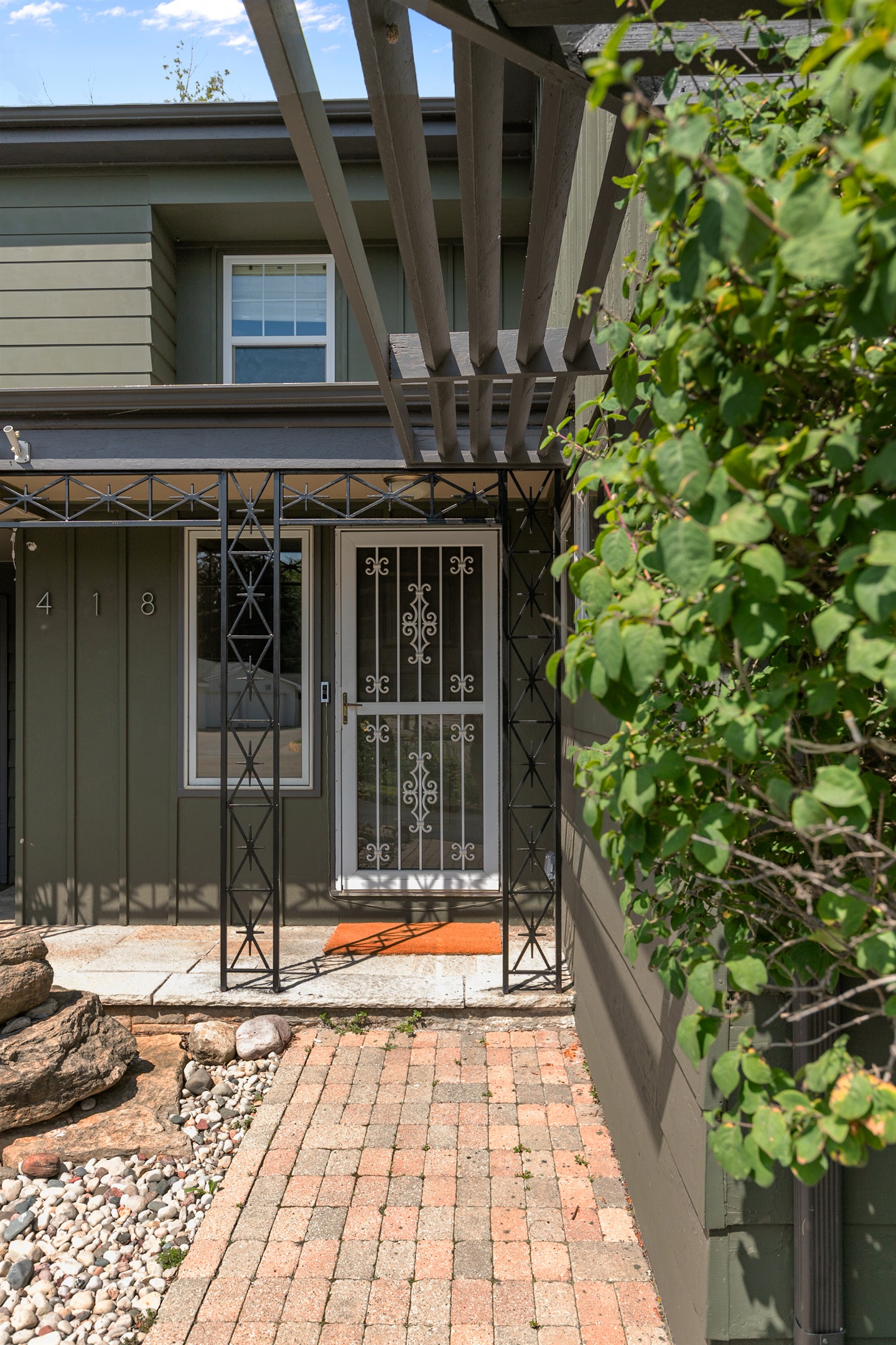 The front door features a secure Schlage smart lock, where you’ll enter your designated code to access the property with ease.