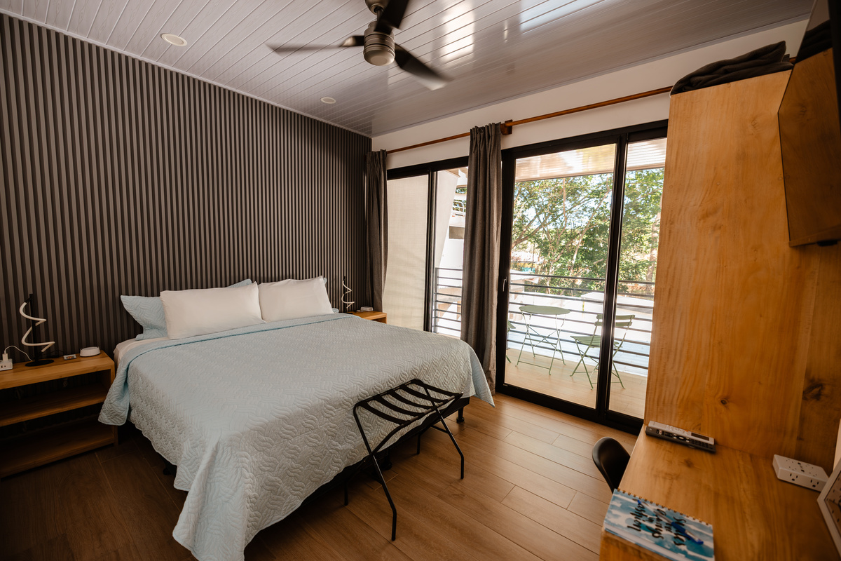 Identical to Bedroom 2. King bed and private balcony.