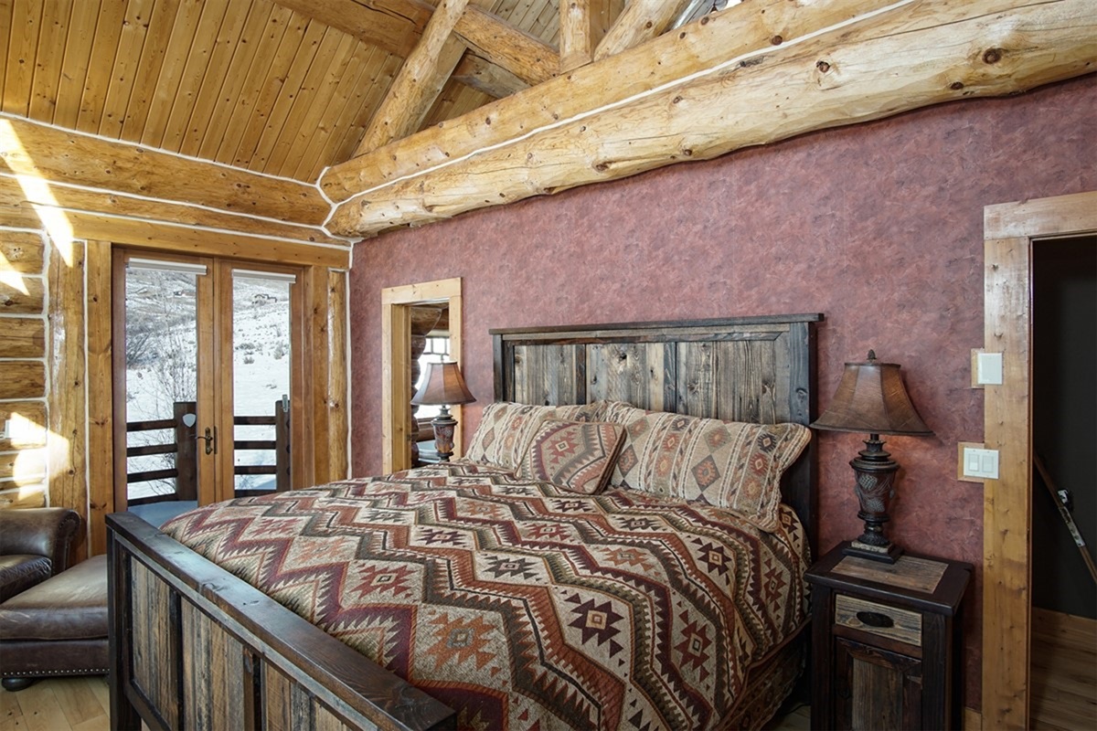 Comfy king bedroom with direct deck access and serene surroundings