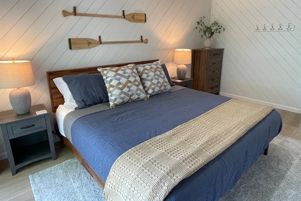 King bed, dresser and plenty of wall hooks