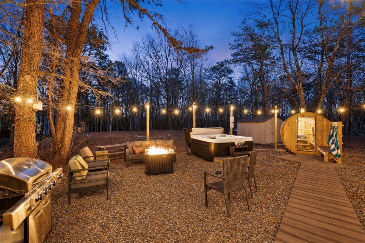 String lights overhead, steam rising from the hot tub, cedar sauna glowing in the dark. Your evenings just got a whole lot better