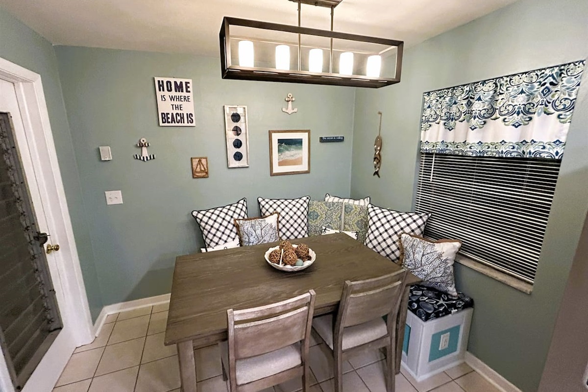 Breakfast Nook/Work Station/Multi-use space. Sit on the comfortable, padded bench or chairs and enjoy a cup of coffee while catching up on emails or other work. USB Plugs located on both sides of bench to charge laptops, phones, tablets etc.