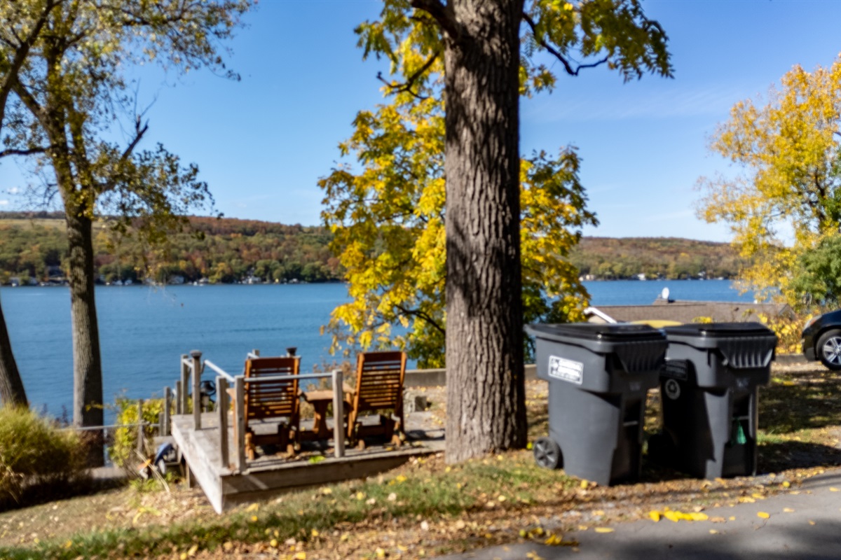 Relax by the water’s edge — the ideal lakefront hangout with firepit and Adirondack chairs