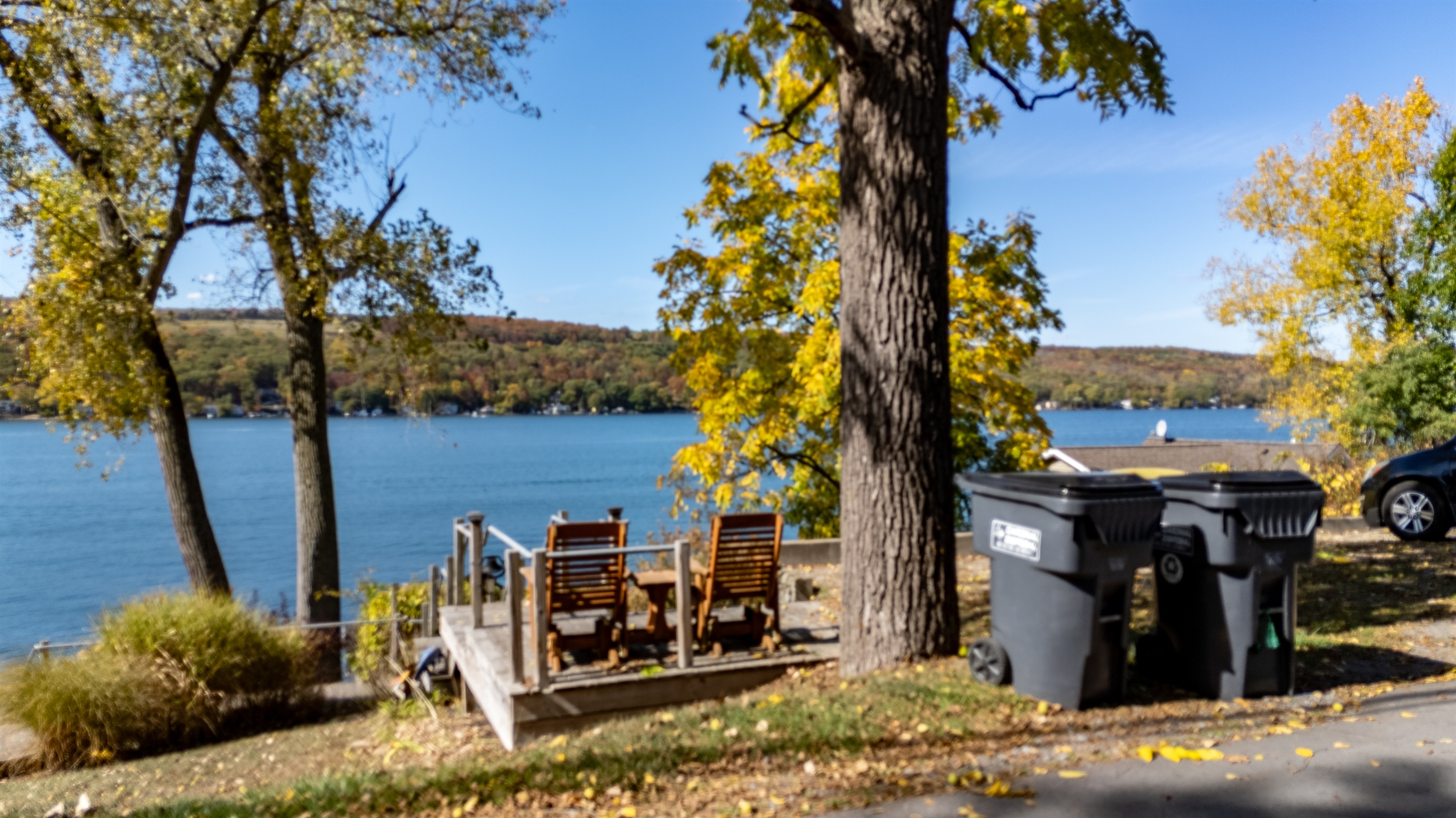 Relax by the water’s edge — the ideal lakefront hangout with firepit and Adirondack chairs