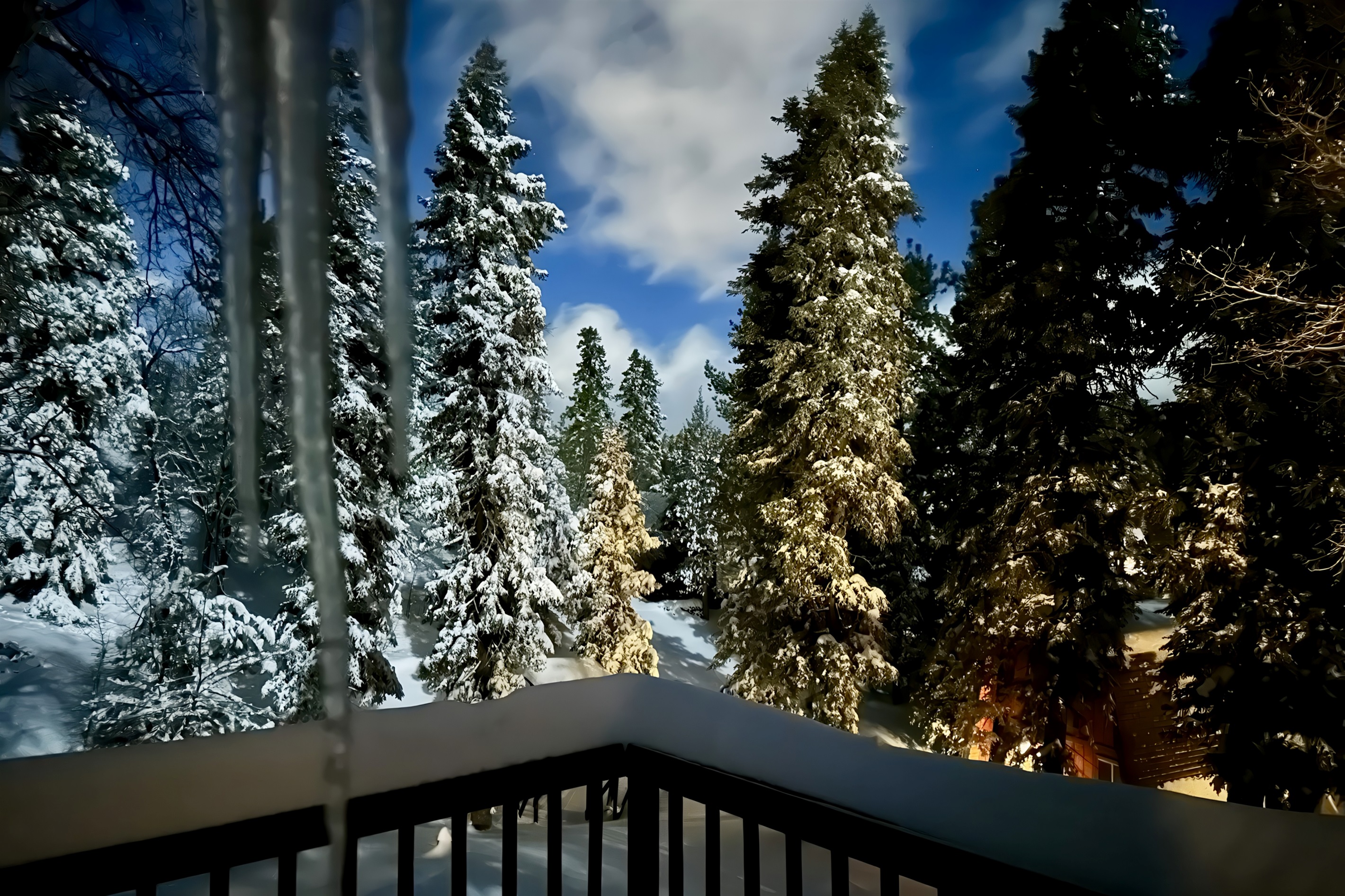 Snowy moonlit night on the back deck outside of the master bedroom