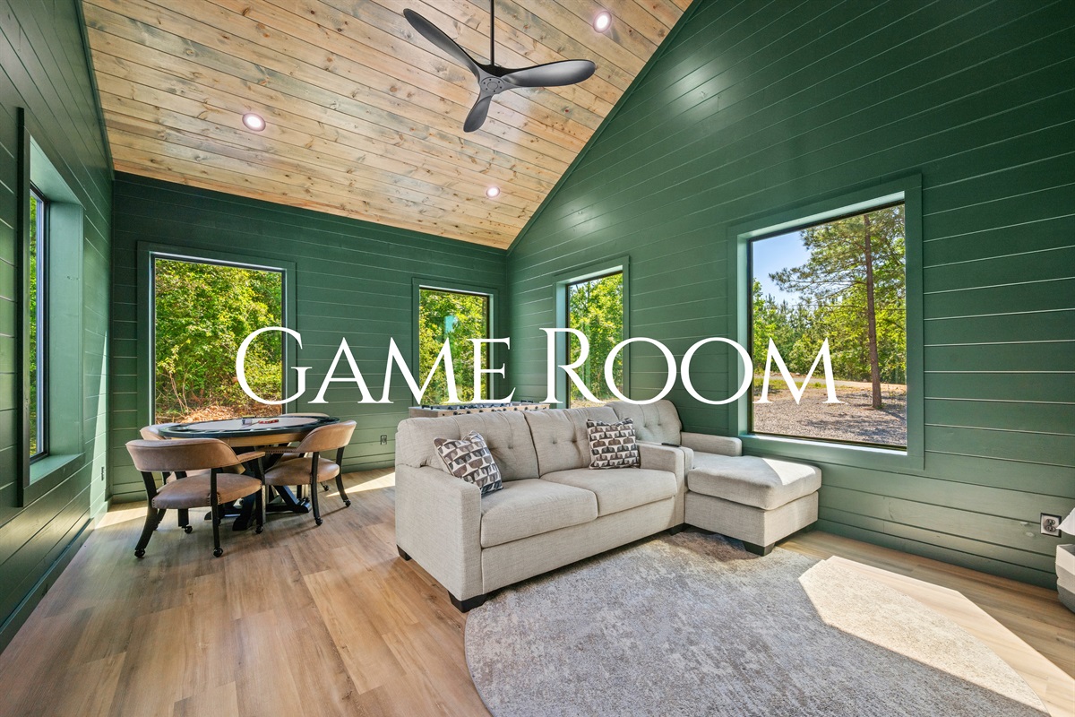 The game room adds another fun hangout spot with plenty of space to relax, play, and spend time together.