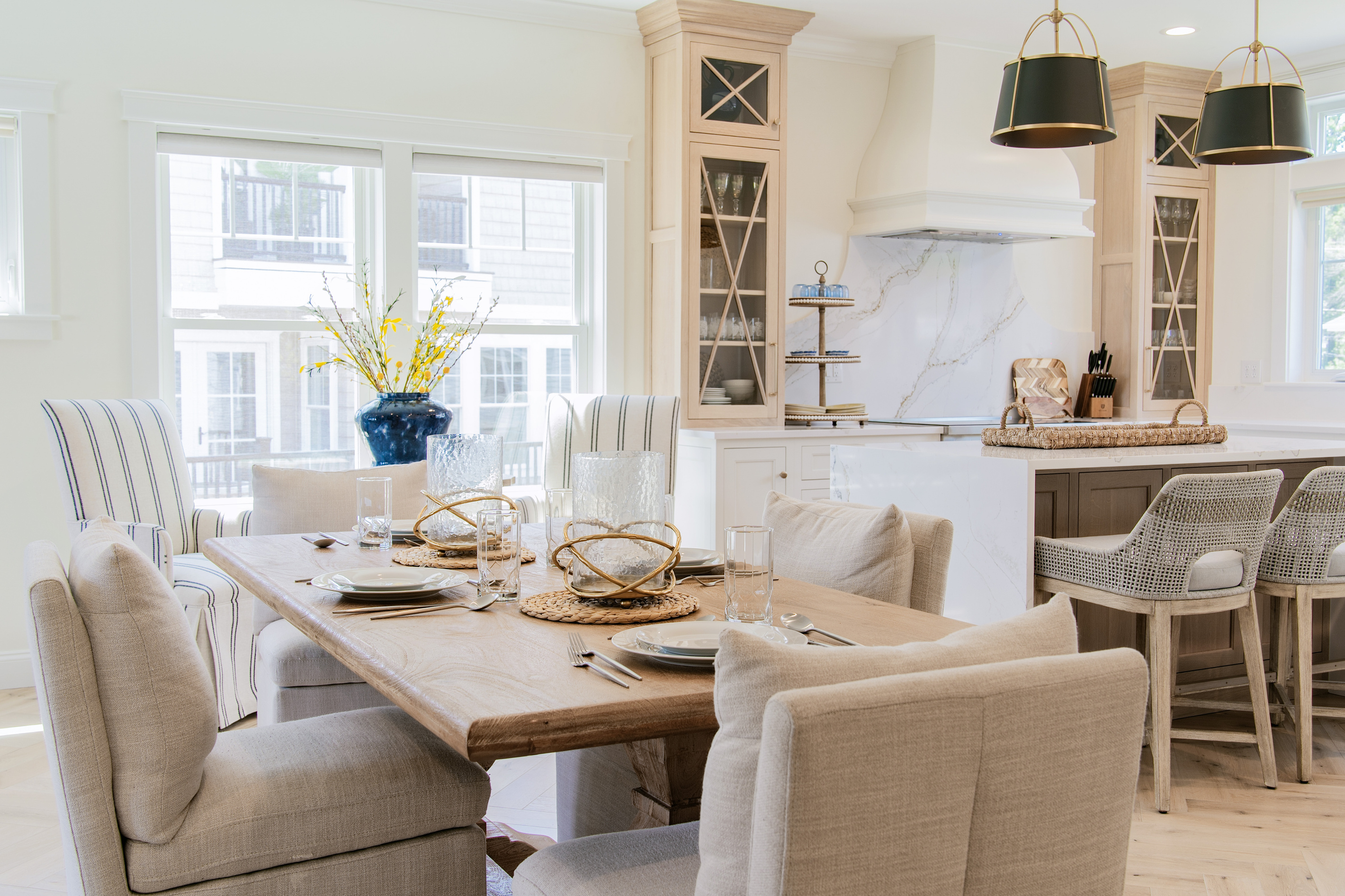 Gather around the dining table for memorable meals in a bright, open kitchen and dining space.
