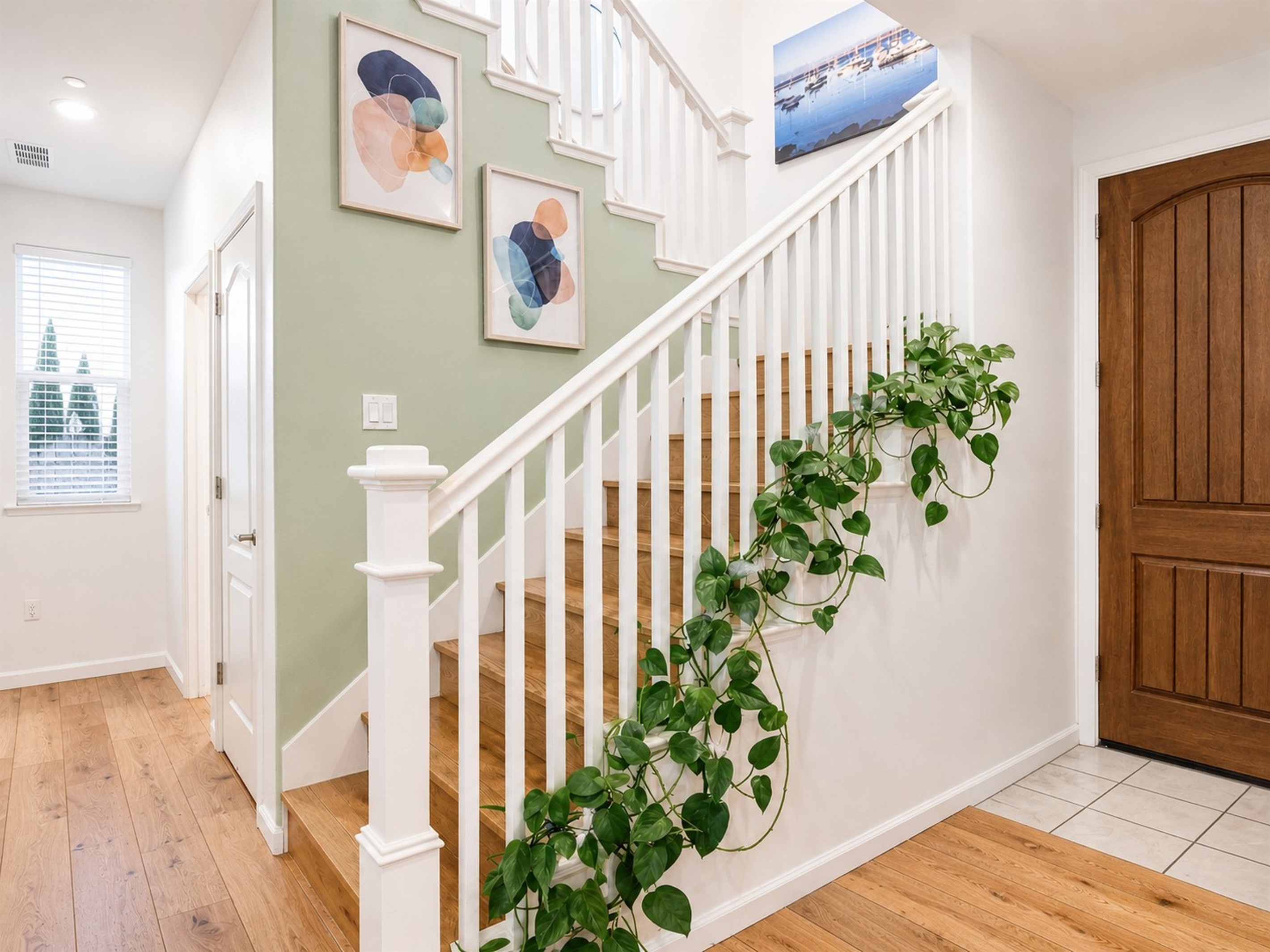 Welcoming entry with staircase and decor