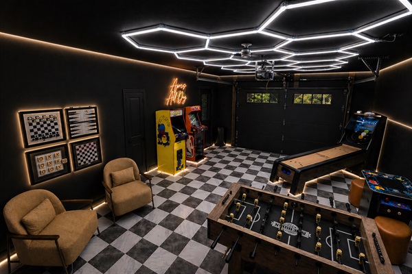 Challenge your crew to foosball under neon blue LEDs, race to the high score on Pac-Man, then settle the debate with a skeeball showdown — no quarters needed, ever.