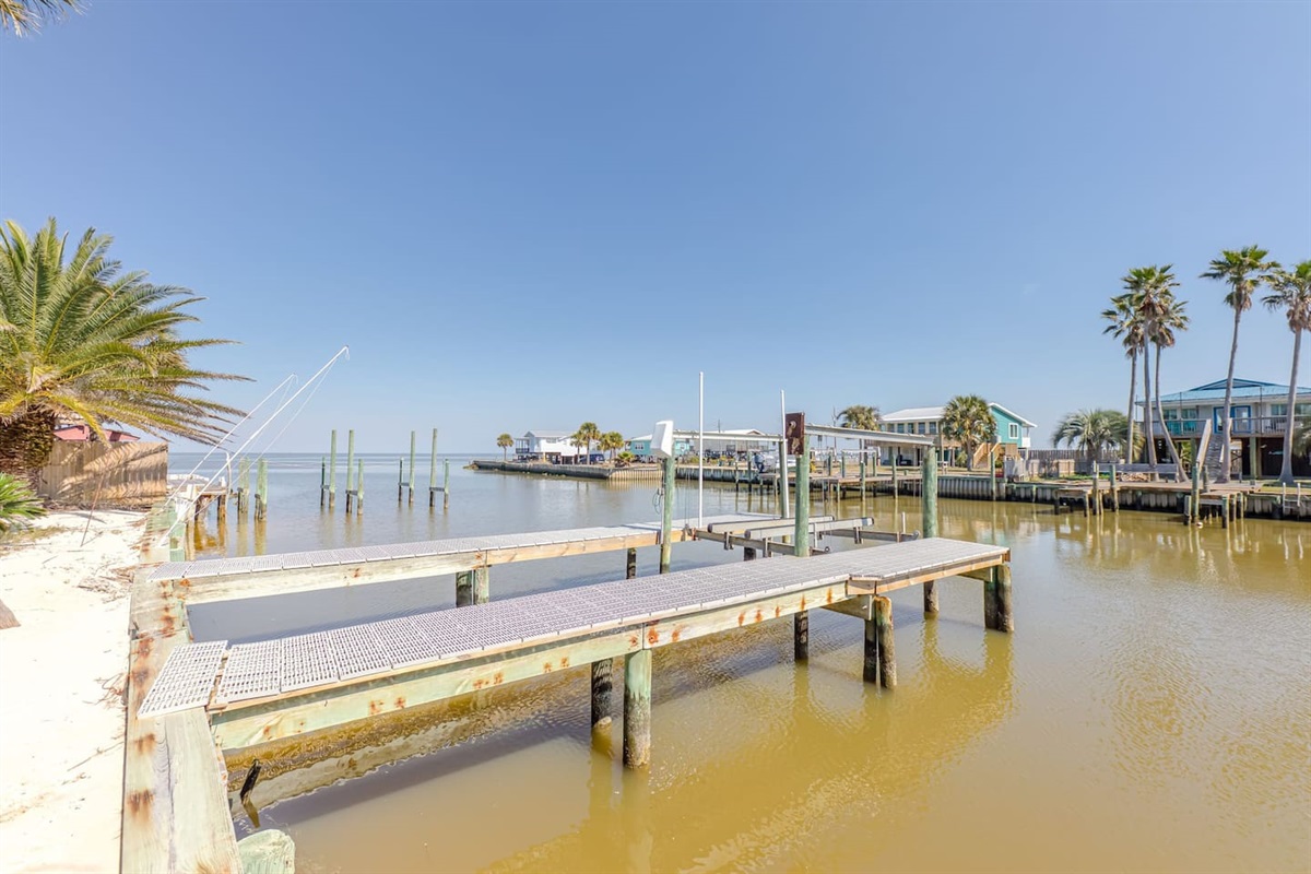 Outdoor Lounge: Enjoy stunning water views and perfect sunsets from your private dock!