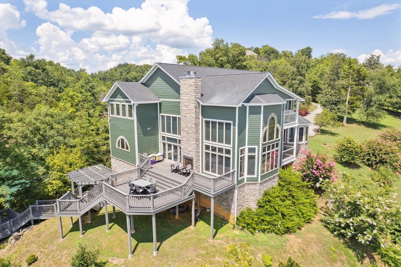 Back of house overlooking water on 22x31ft upper Deck and 9x14 ft lower deck