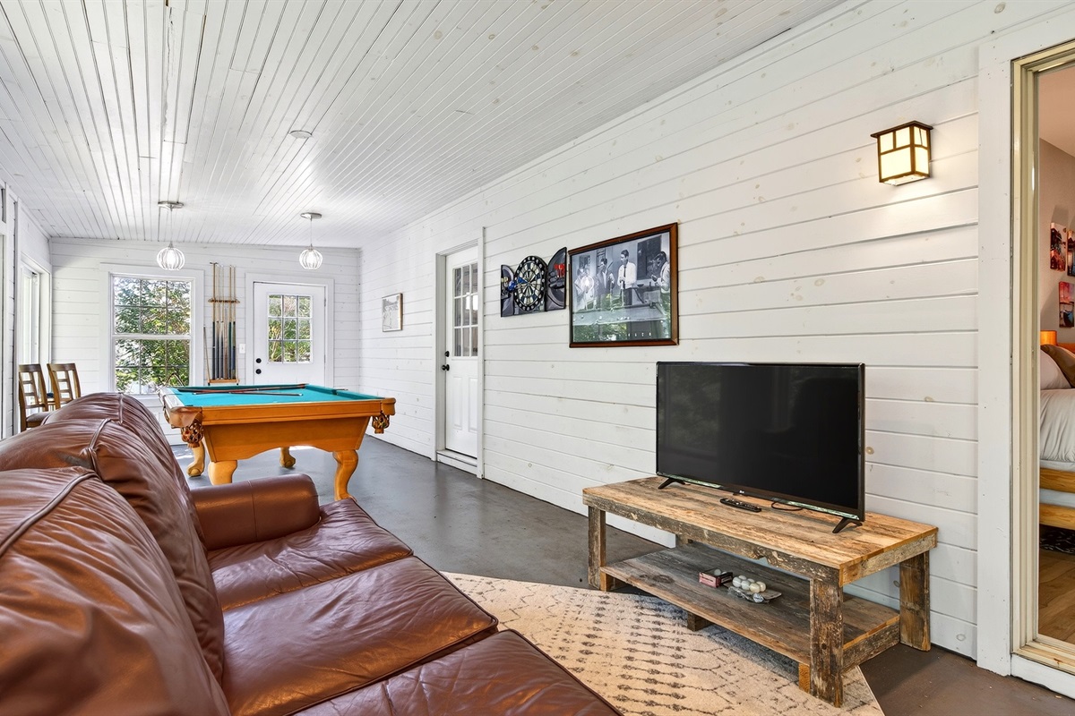 Game room features a TV.