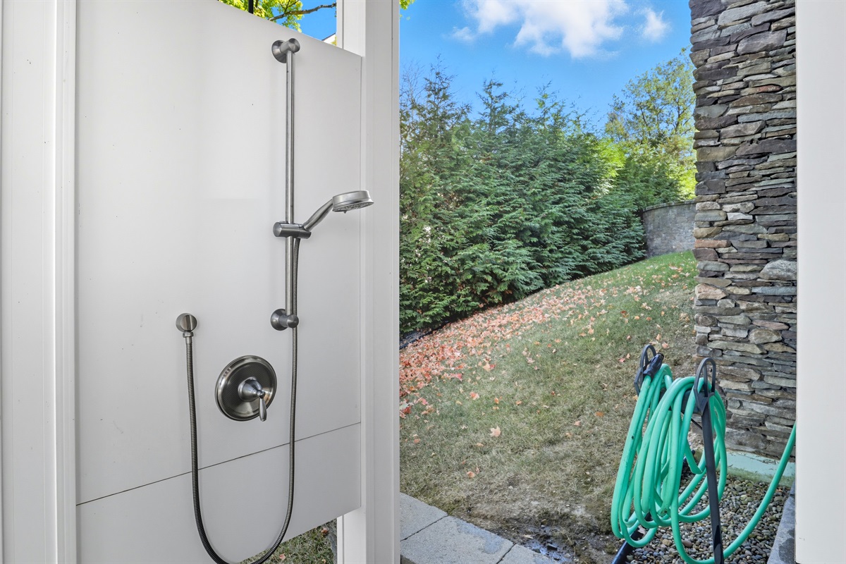 Outdoor shower to rinse off after a day on the lake