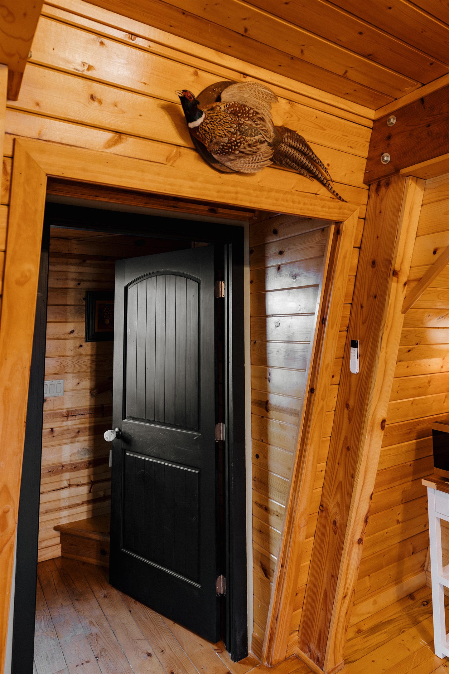 Poppywood Pines’ character shines through rustic wood beams, custom doors, and curated lodge details that create an authentic mountain cabin feel—offering a warm, one-of-a-kind A-frame stay in Arizona’s White Mountains.