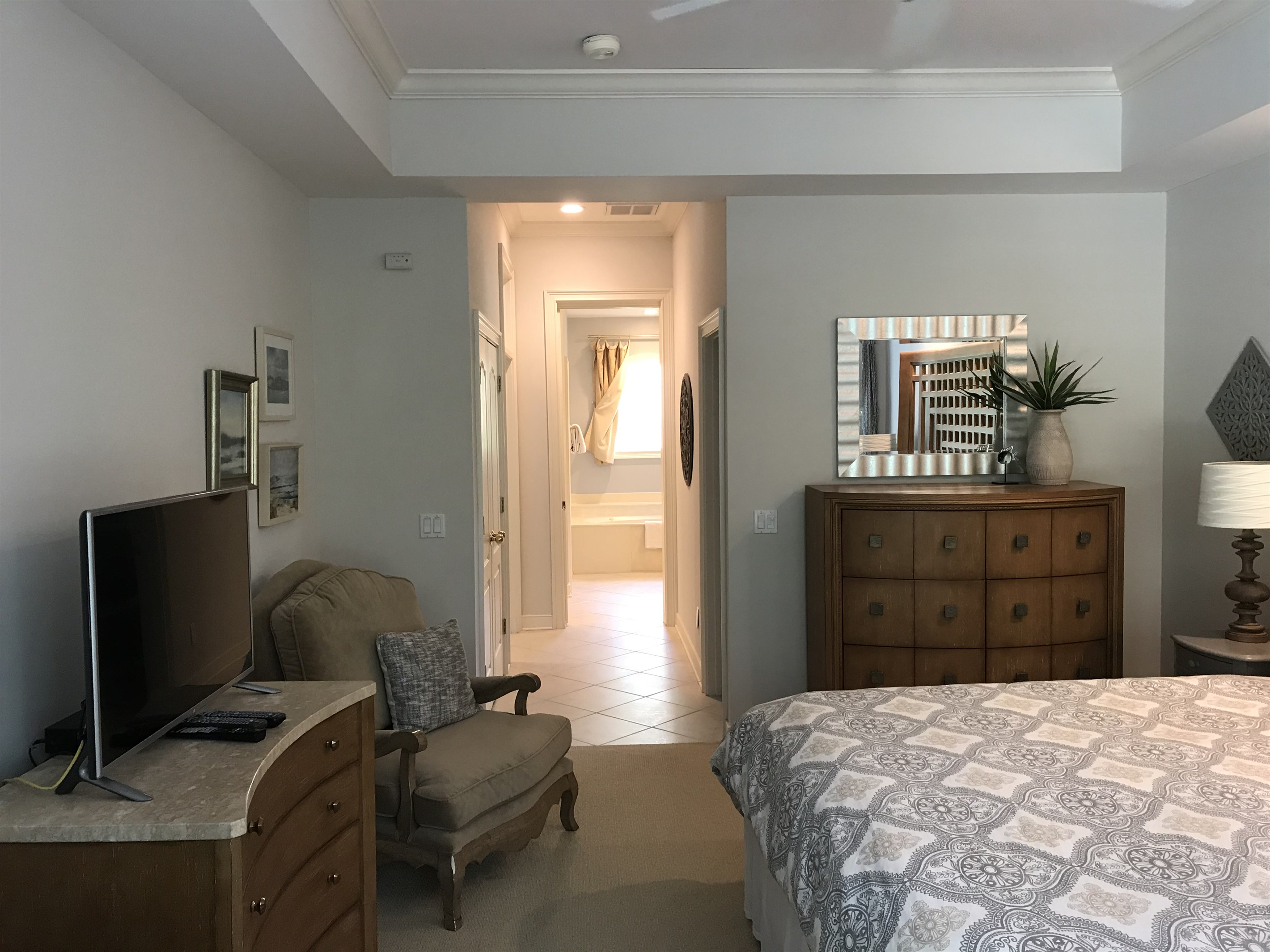 Two dressers and a walk-in closet, hallway to master bathroom