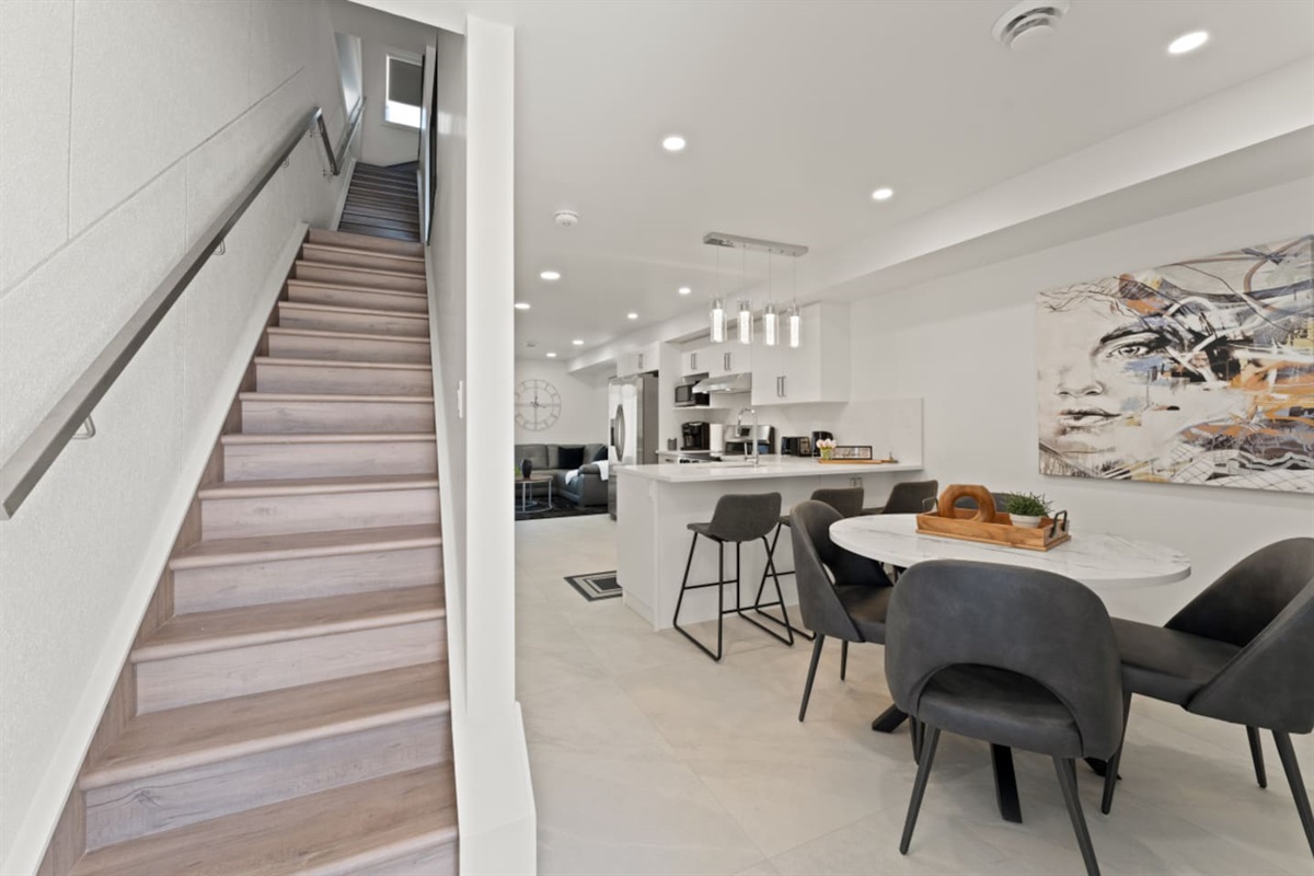 Stairs leading to the 2nd and 3rd floor bedroom areas.