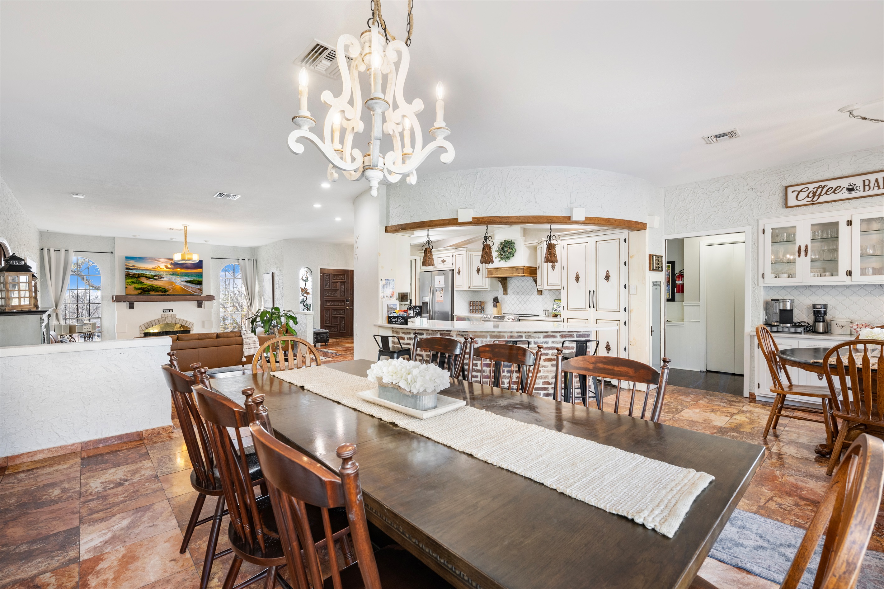 Dining room in open concept main level - breakfast nook to right, bar seating at kitchen bar, living room close at hand - gathering made easy. 