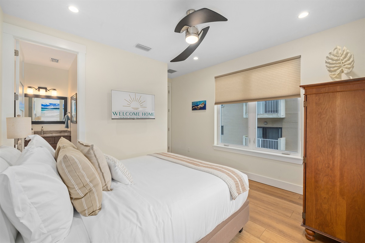 Cozy guest bedroom with queen bed and coastal charm