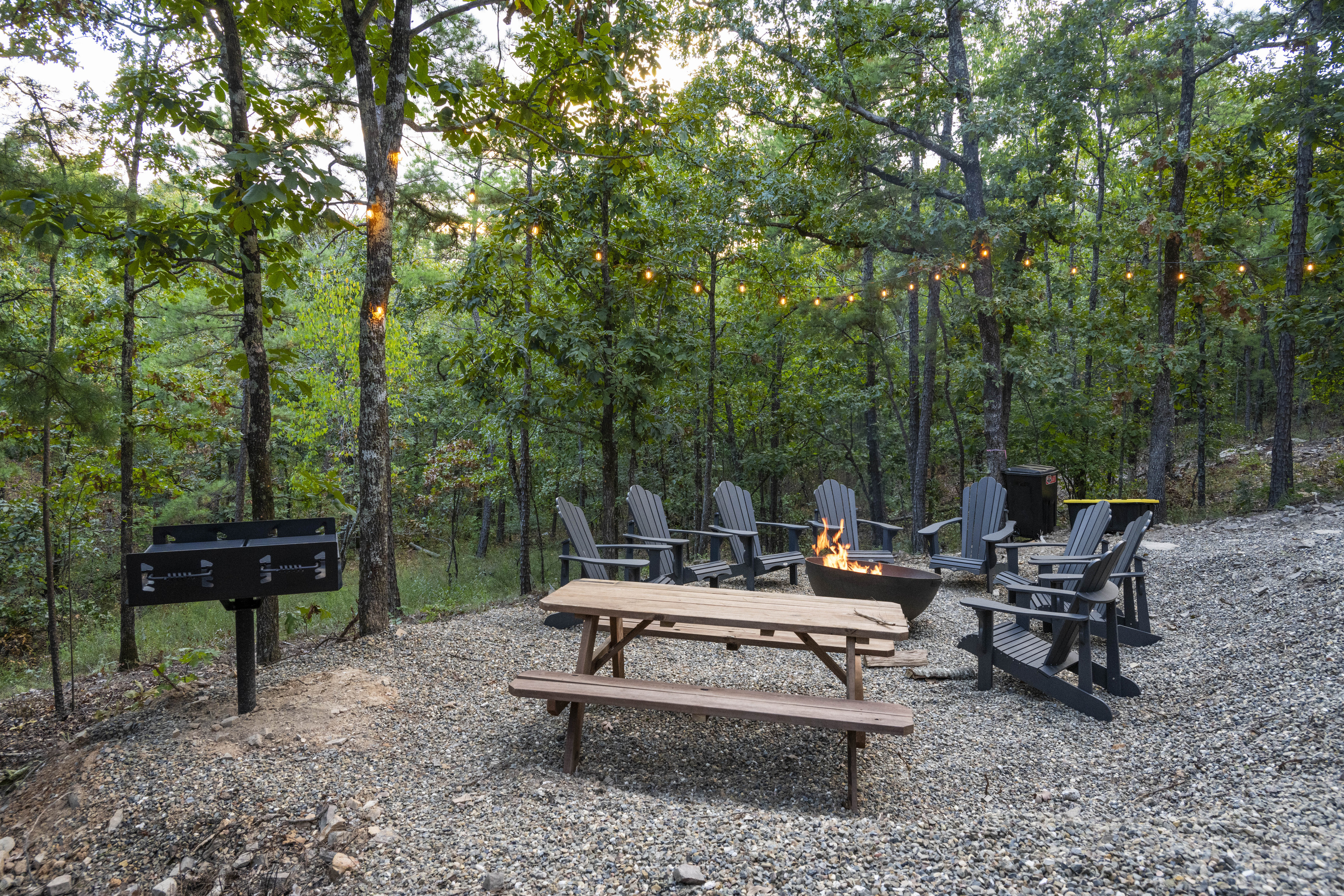 Enjoy the fire pit for creating unforgettable evenings beneath the shimmering twinkle lights.