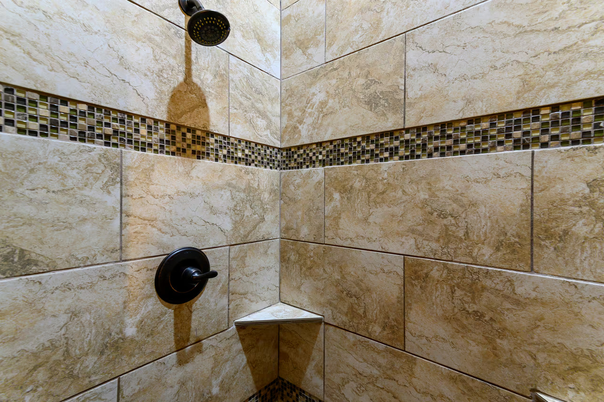 Luxurious Shower: Indulge in rainfall showers and stylish tile accents for ultimate relaxation!