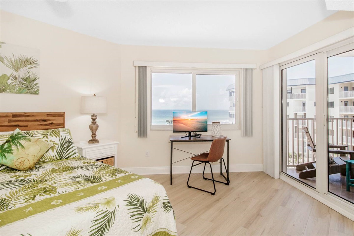 King size master bedroom with pool/gulf views and patio access. 