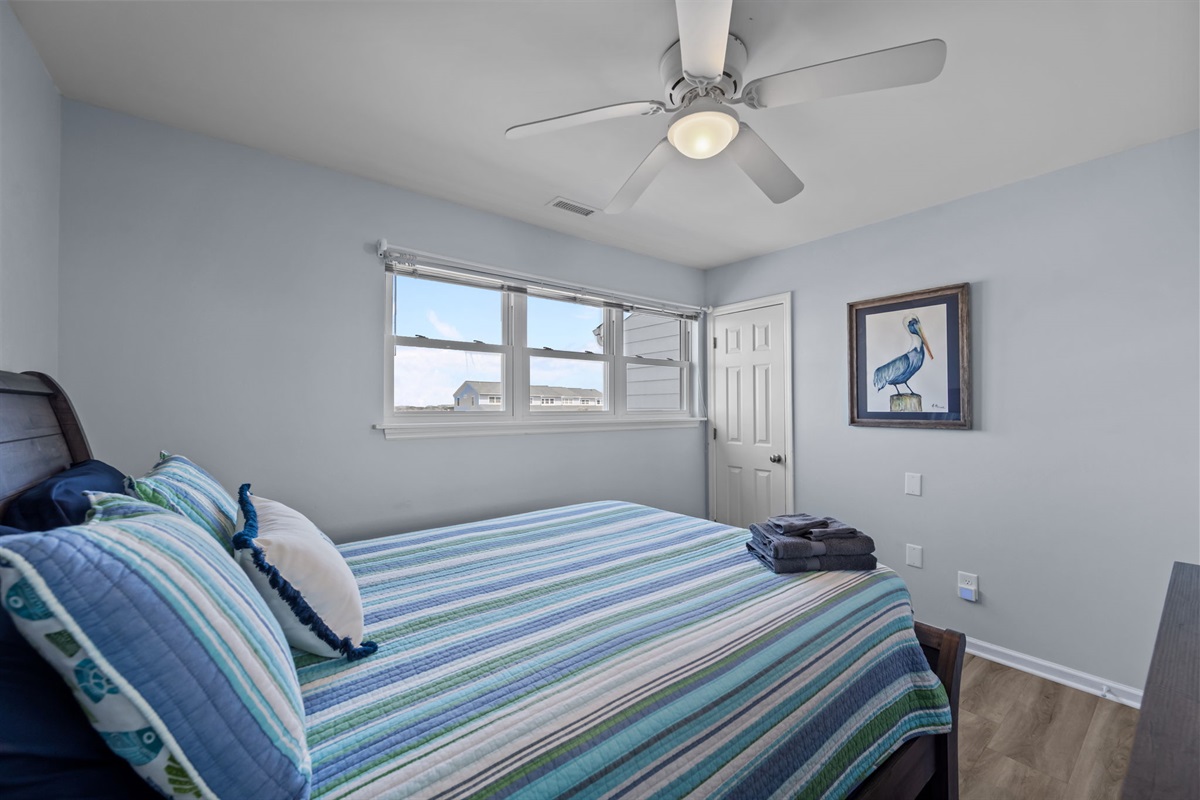 Clothing storage and wall art in 2nd bedroom