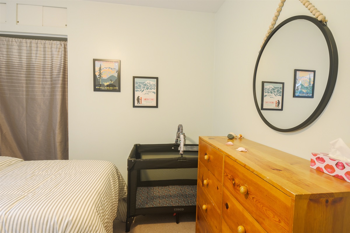 Playpen and changing area in spare bedroom
